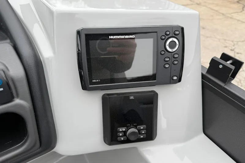 Slide: The Image of Control panel of 2026 Bentley Pontoons Legacy 243 Navigator with Humminbird Helix 5 and JBL system. - 10