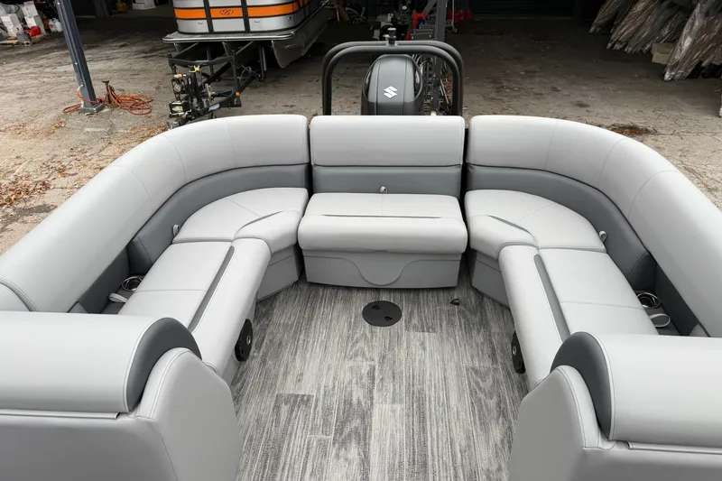 Slide: The Image of 2026 Bentley Pontoons Legacy 243 Navigator interior with gray seating and wood-style flooring. - 7