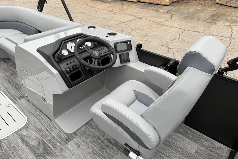 Slide: The Image of 2026 Bentley Pontoons Legacy 243 Navigator helm with modern controls and comfortable seating. - 8