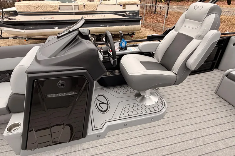 Slide: The Image of 2026 Veranda VR 235 VL boat interior with captain's chair and sleek dashboard design. - 10