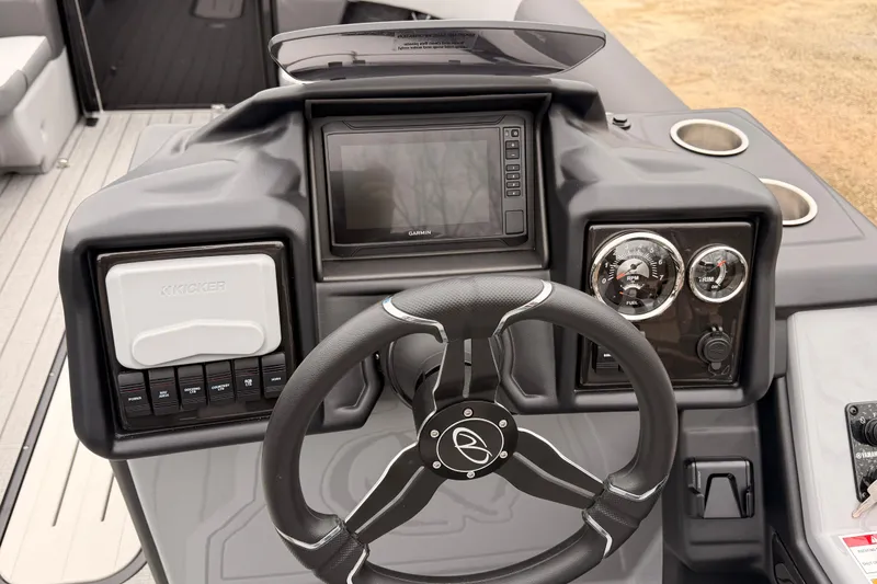 Slide: The Image of 2026 Veranda VR 235 VL boat dashboard with steering wheel, gauges, and control panel. - 12