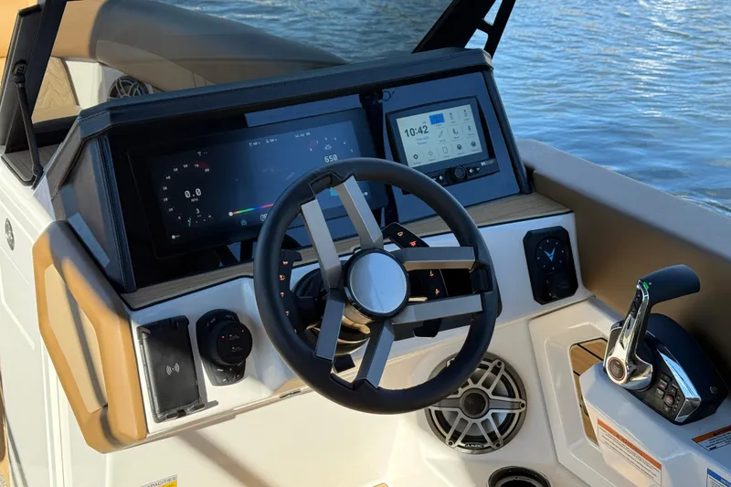 Slide: The Image of 2026 Revel RS25 boat dashboard with modern steering wheel and digital displays. - 15