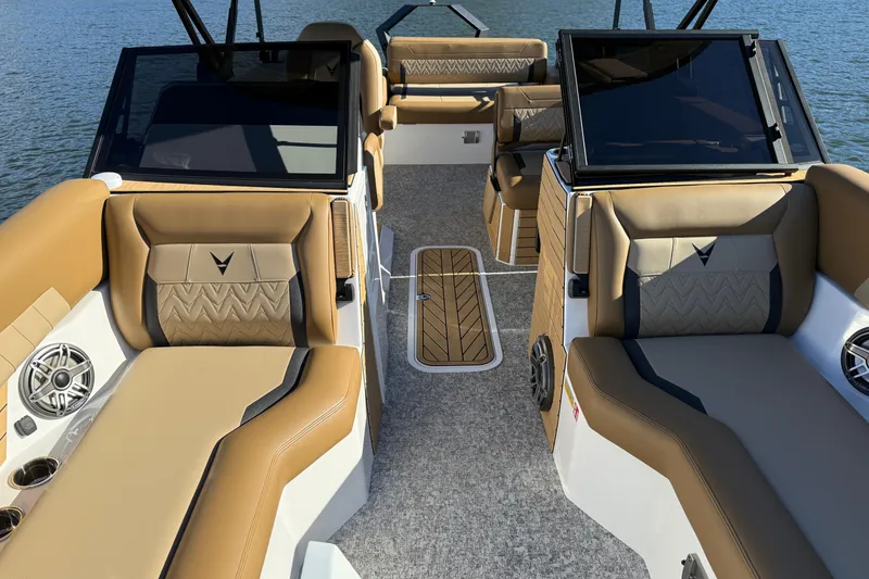Slide: The Image of Luxurious interior of 2026 Revel RS25 boat with tan seating and modern design. - 18