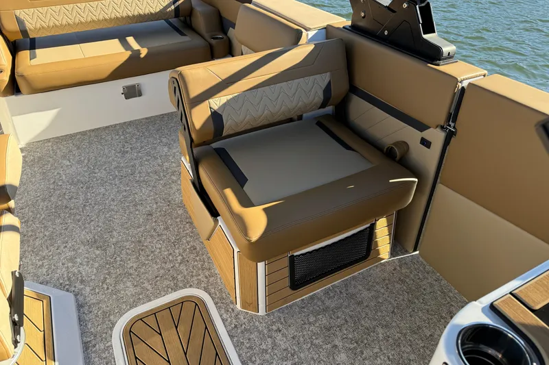 Slide: The Image of Luxurious seating on 2026 Revel RS25 boat with tan upholstery and modern design. - 19