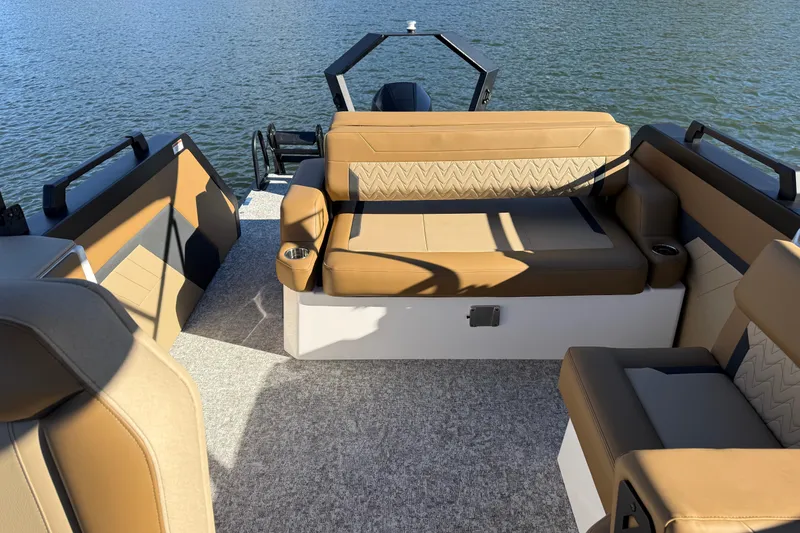 Slide: The Image of Luxurious interior of 2026 Revel RS25 boat with tan seating and water view. - 21