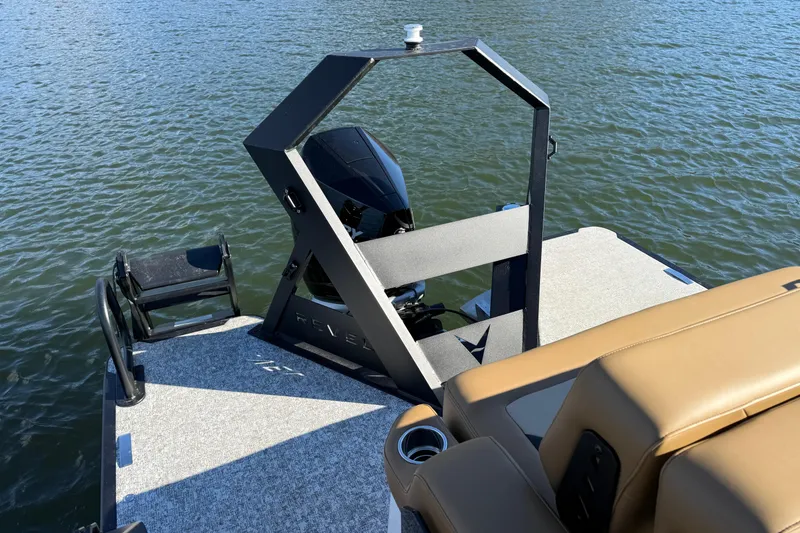 Slide: The Image of 2026 Revel RS25 boat with modern design on calm water. - 22