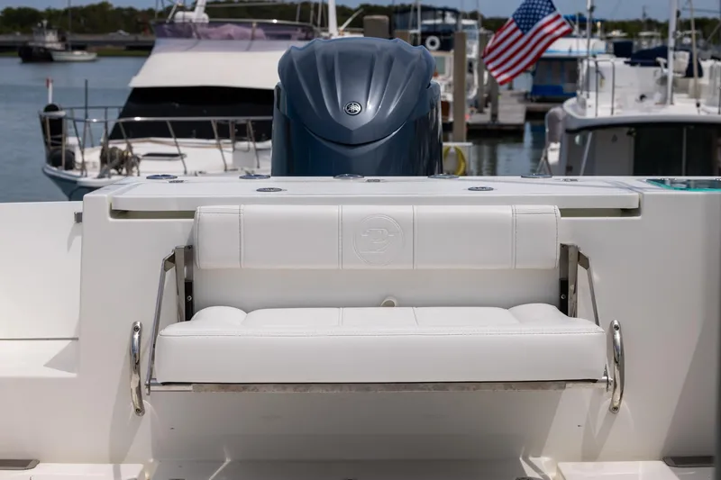 Slide: The Image of 2026 Parker 227 Explorer boat with white seating, docked in marina. - 12