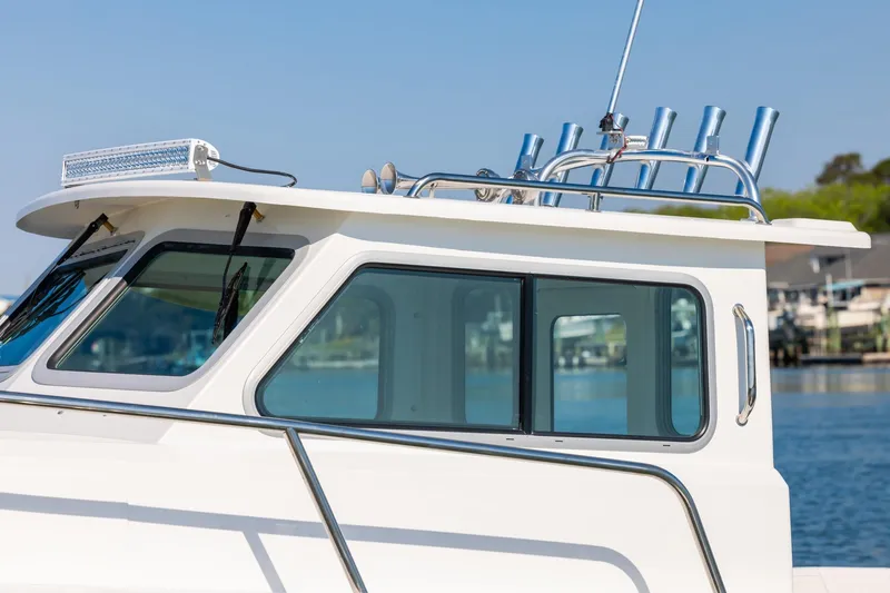 Slide: The Image of 2026 Parker 227 Explorer boat cabin with sleek design and chrome accents. - 7