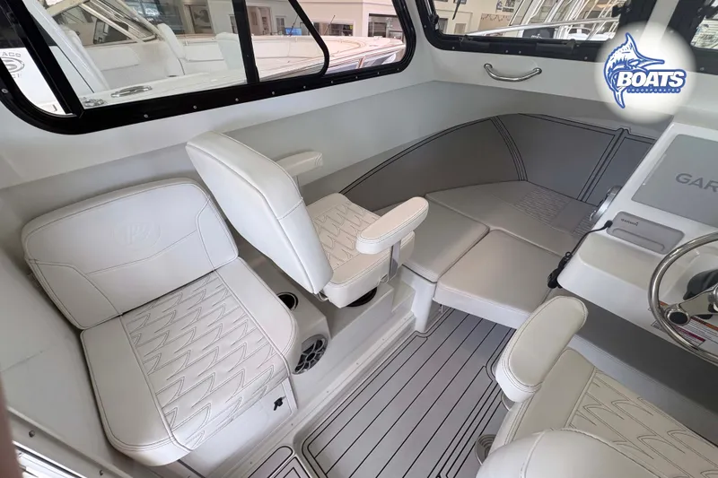 Slide: The Image of Interior of 2027 Parker 227 Explorer boat with white seating and modern design. - 7