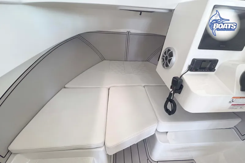 Slide: The Image of Interior of 2027 Parker 227 Explorer boat with cushioned seating and control panel. - 8