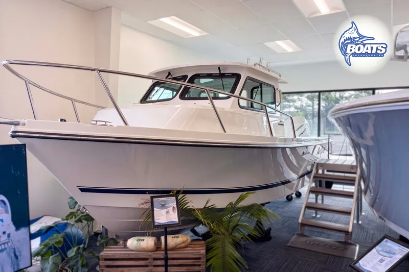 The Image of 2027 Parker 227 Explorer boat displayed indoors with sleek design and modern features. - 0