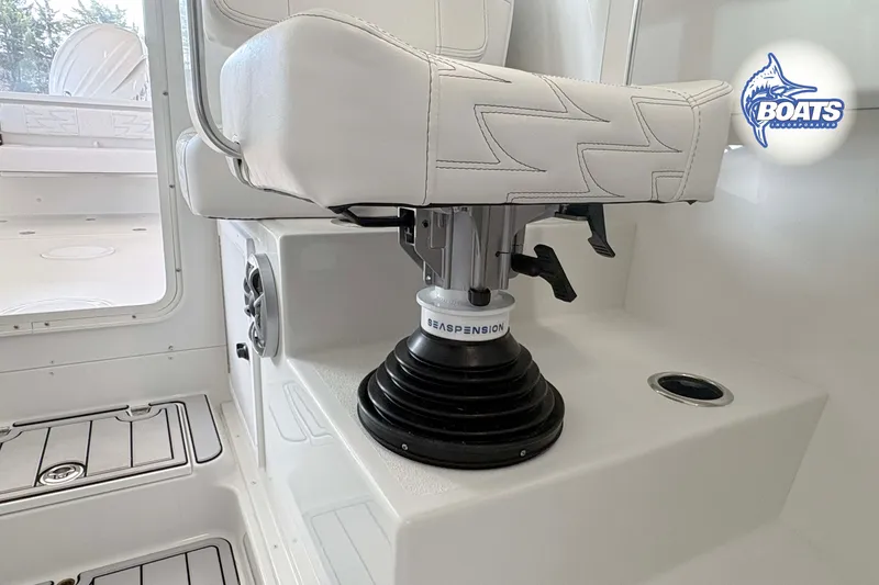 Slide: The Image of 2027 Parker 227 Explorer boat interior with suspension seat and white upholstery. - 9
