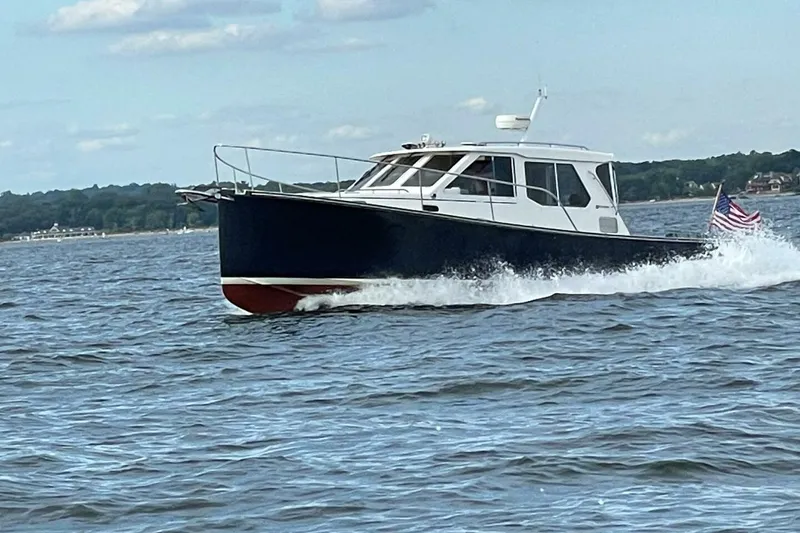 Slide: The Image of 2006 True North 38 boat docked at marina, top deck view. - 8