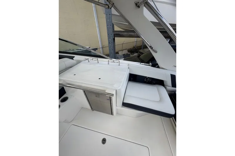 Slide: The Image of 2022 Regal 29 OBX boat interior with white seating and sleek design. - 11