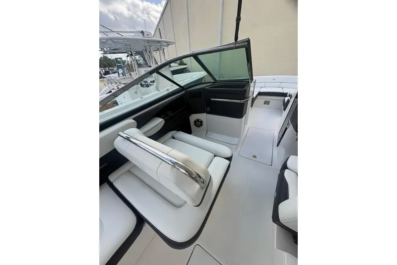 Slide: The Image of 2022 Regal 29 OBX boat interior with white seating and sleek design. - 15