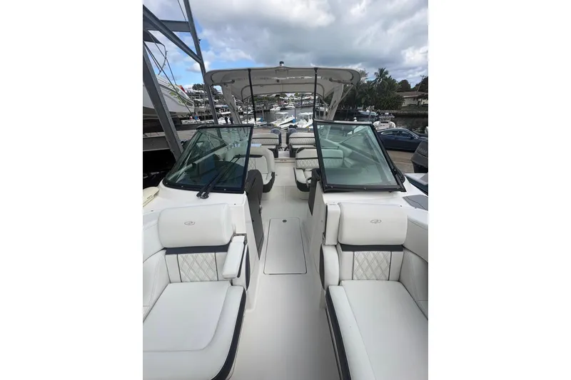 Slide: The Image of 2022 Regal 29 OBX boat interior with luxurious seating and open deck design. - 20