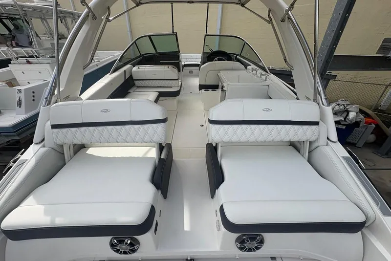 Slide: The Image of 2022 Regal 29 OBX boat interior with luxurious white seating and modern design. - 22