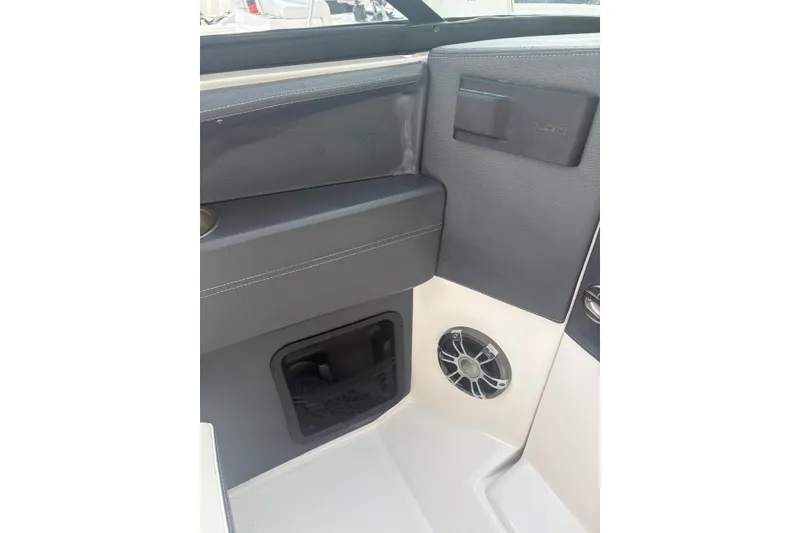 Slide: The Image of Interior detail of 2022 Regal 29 OBX boat, featuring speaker and storage compartment. - 26