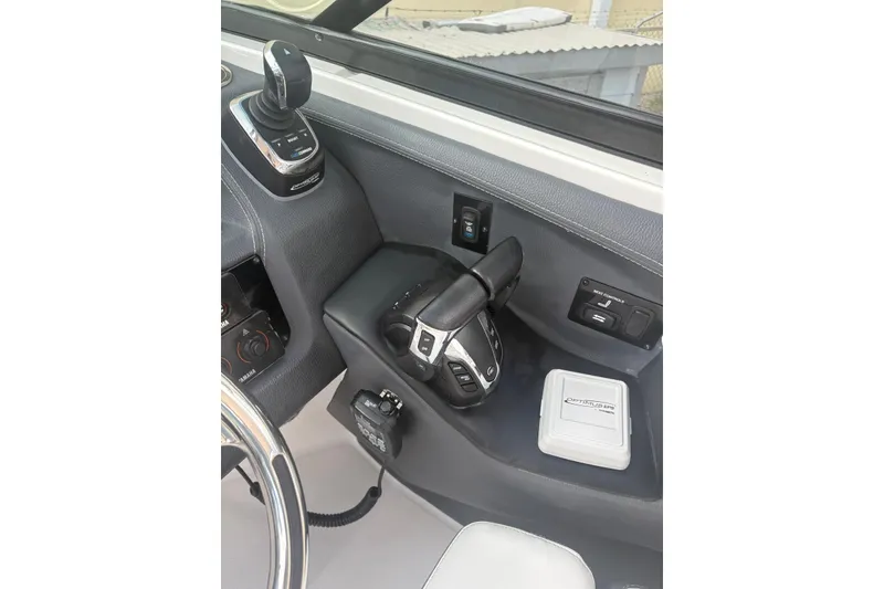 Slide: The Image of 2022 Regal 29 OBX boat cockpit with steering and control panel. - 27