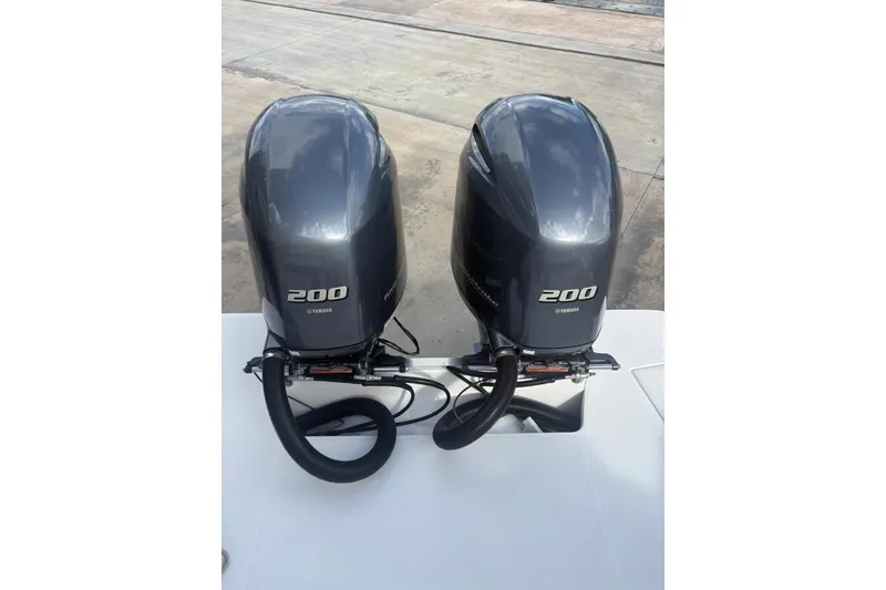 Slide: The Image of Twin Yamaha 200 outboard engines on a 2022 Regal 29 OBX boat. - 30
