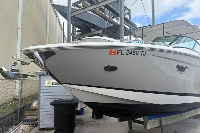 Slide: The Image of 2022 Regal 29 OBX boat docked, displaying registration FL 2460 TJ. - 6