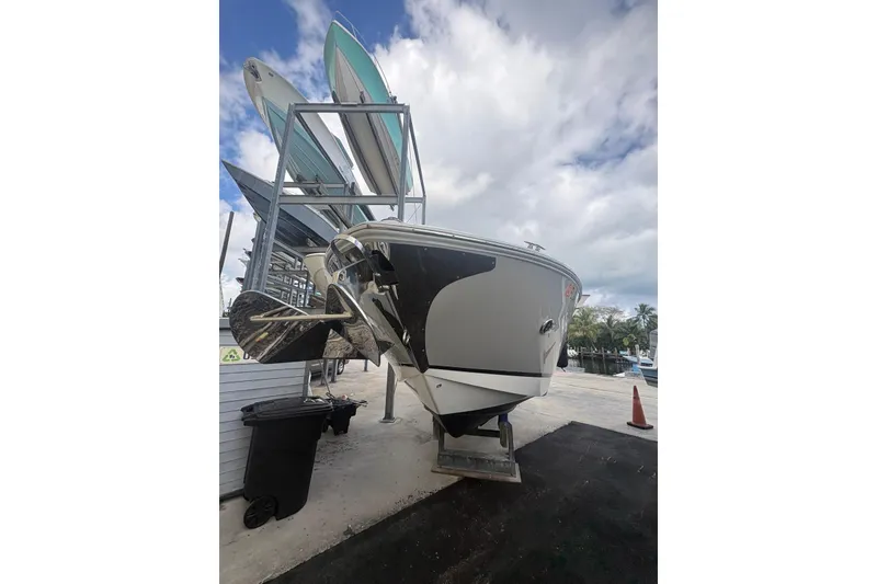 Slide: The Image of 2022 Regal 29 OBX boat on dry dock with clear sky background. - 8