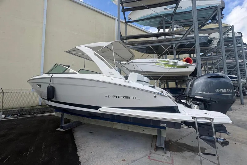 Slide: The Image of 2022 Regal 29 OBX boat with Yamaha engine in storage facility. - 9
