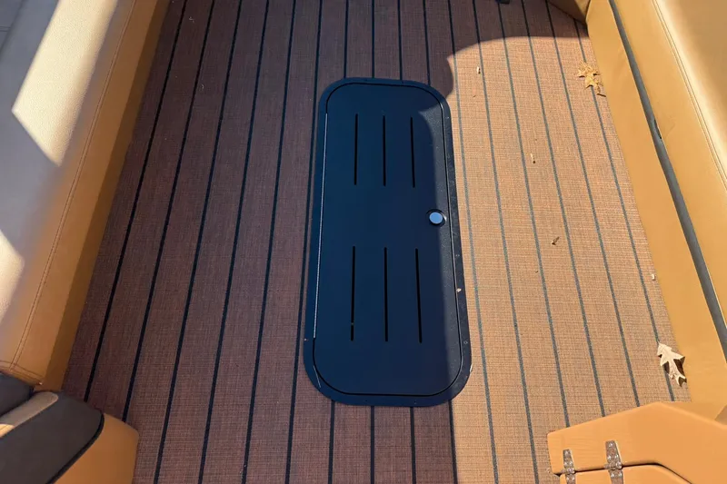Slide: The Image of Interior of 2026 Bentley Pontoons Elite 253 Swingback with wood flooring. - 9