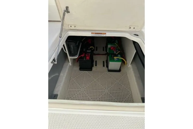 Slide: The Image of 2021 Robalo R317 Dual Console boat battery compartment with organized wiring. - 12