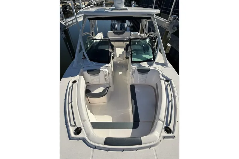 Slide: The Image of 2021 Robalo R317 Dual Console boat interior with seating and open deck layout. - 20