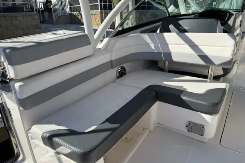 Slide: The Image of 2021 Robalo R317 Dual Console boat interior with cushioned seating. - 3