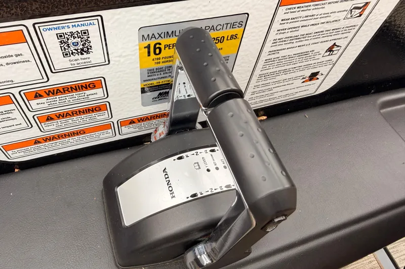 Slide: The Image of Control panel of 2023 Premier 270 Intrigue REV 10 Wide Twin Engine with safety warnings. - 12