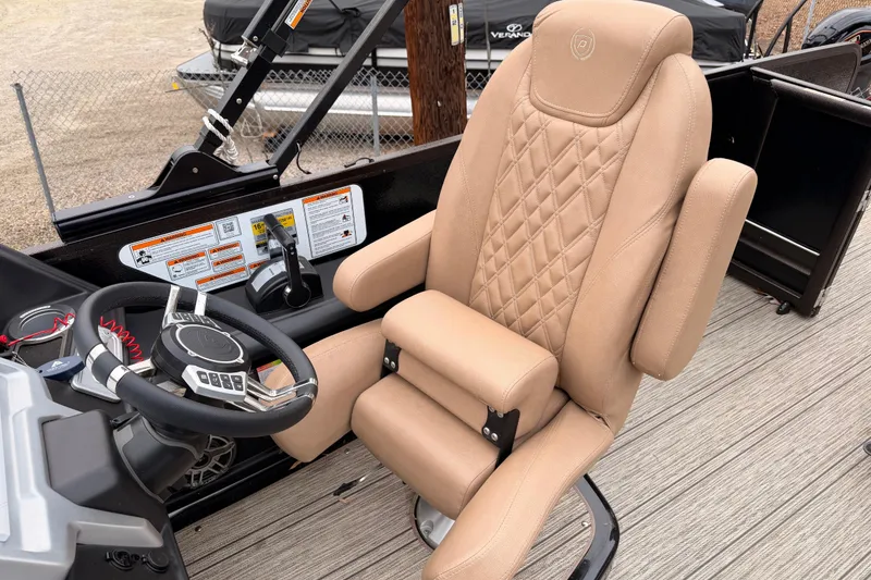 Slide: The Image of Captain's chair and steering wheel of 2023 Premier 270 Intrigue REV 10 Wide Twin Engine boat. - 13