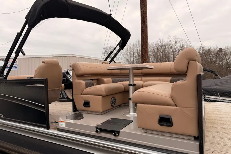 Slide: The Image of 2023 Premier 270 Intrigue REV 10 Wide Twin Engine pontoon with luxurious seating and table. - 8
