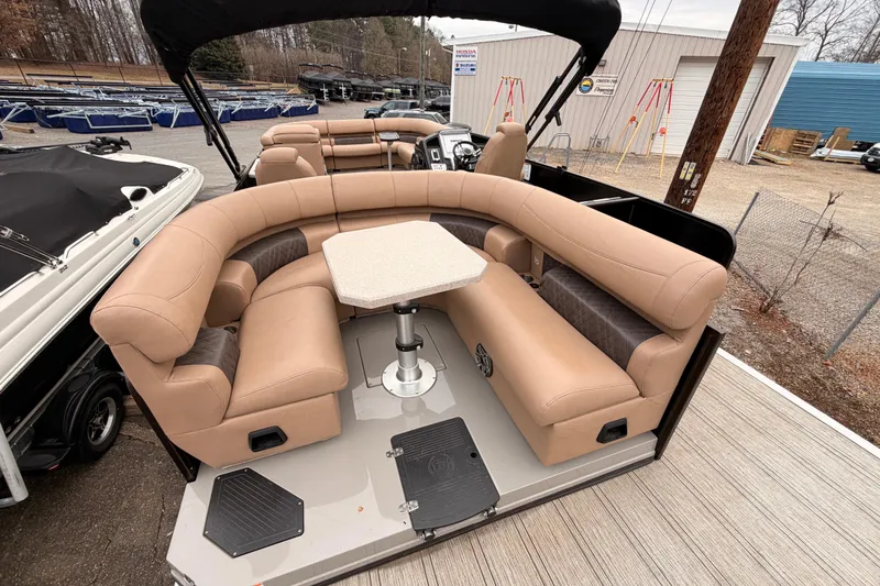 Slide: The Image of 2023 Premier 270 Intrigue REV 10 Wide Twin Engine pontoon with luxurious seating and table. - 9