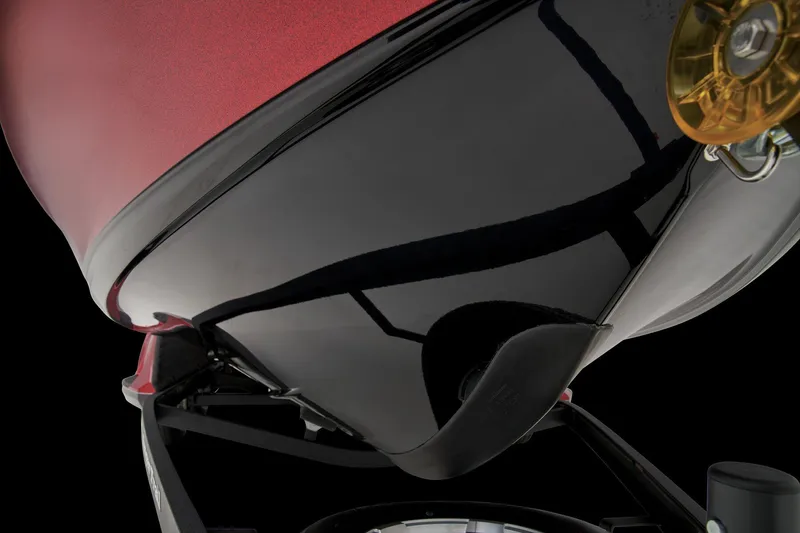 Slide: The Image of 2026 Ranger 1850MS boat interior with red and gray seating, parked outdoors. - 14