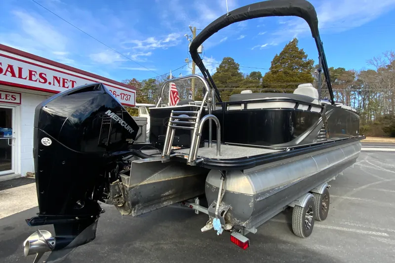 Slide: The Image of 2021 Avalon LSZ Quad Lounger 24' pontoon boat with Mercury outboard motor. - 10