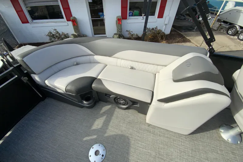 Slide: The Image of 2021 Avalon LSZ Quad Lounger boat interior with gray seating and carpeted floor. - 19