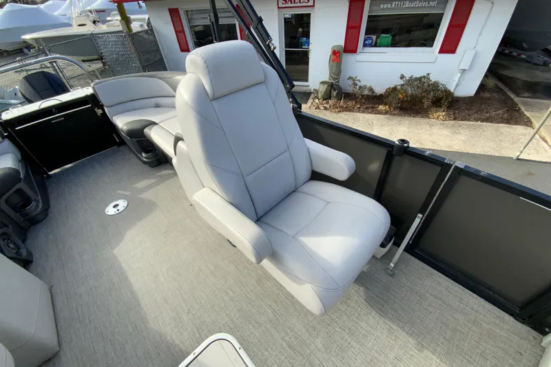 Slide: The Image of 2021 Avalon LSZ Quad Lounger boat interior with plush seating and modern design. - 21