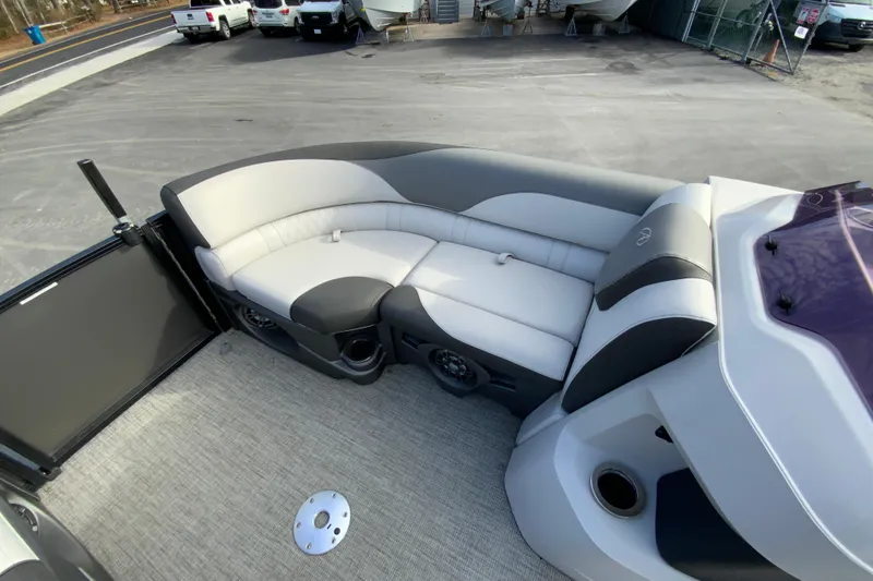 Slide: The Image of 2021 Avalon LSZ Quad Lounger boat interior with gray and white seating. - 23