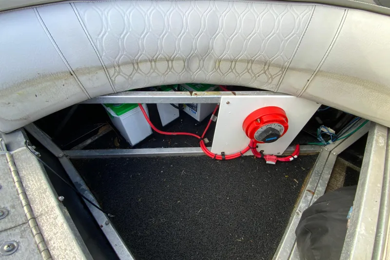 Slide: The Image of 2021 Avalon LSZ Quad Lounger interior showing battery compartment and wiring. - 26