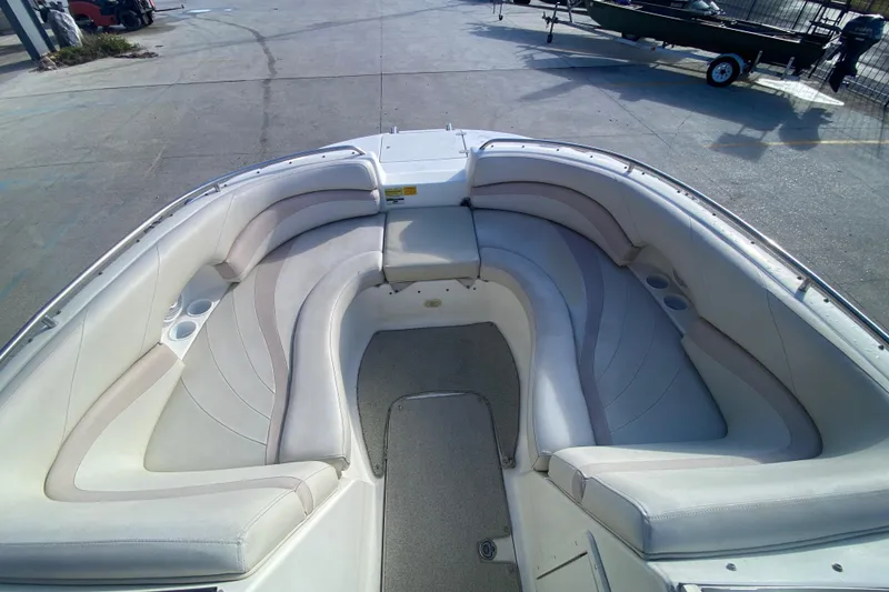 Slide: The Image of 2007 NauticStar 230DC Sport Deck boat with spacious seating and cup holders. - 12