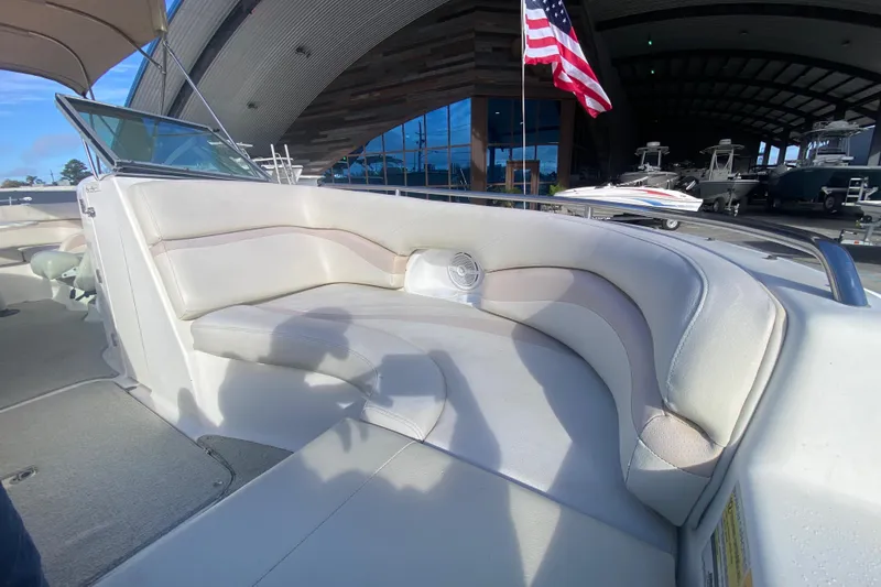 Slide: The Image of 2007 NauticStar 230DC Sport Deck boat interior with cushioned seating and American flag. - 14