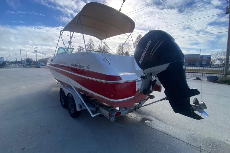 Slide: The Image of 2007 NauticStar 230DC Sport Deck boat with Mercury engine on trailer. - 5