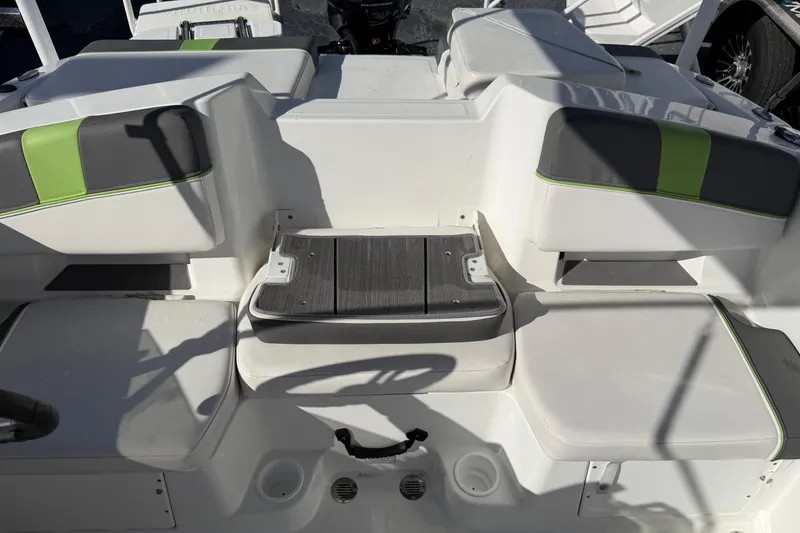 Slide: The Image of 2023 Tahoe T18 boat interior with white and green seating, showcasing modern design. - 13