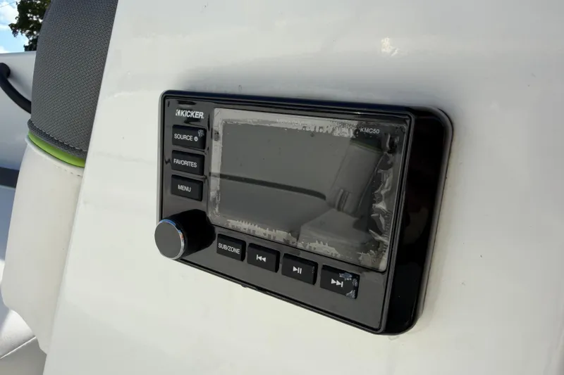 Slide: The Image of Kicker audio system on 2023 Tahoe T18 boat dashboard. - 25
