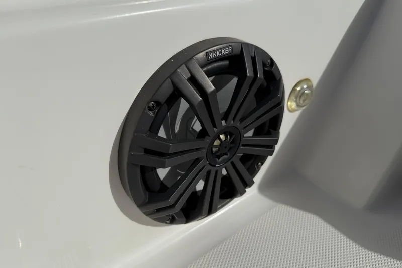 Slide: The Image of 2023 Tahoe T18 boat speaker with Kicker audio system on white surface. - 26