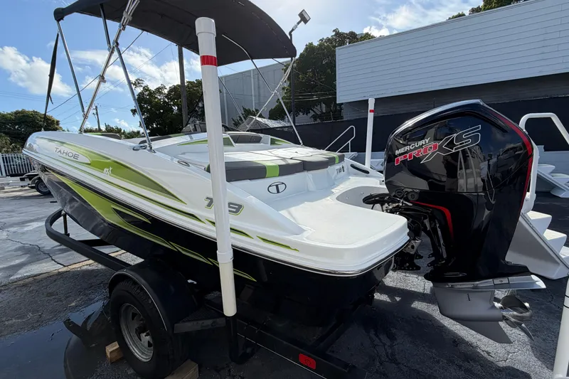 Slide: The Image of 2023 Tahoe T18 boat with Mercury Pro XS engine on trailer, outdoor display. - 3