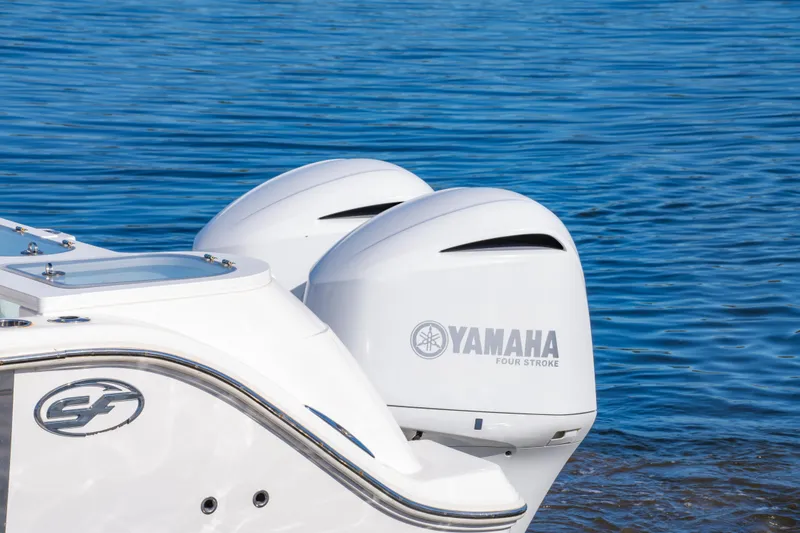 Slide: The Image of 2019 Sea Fox 328 Commander with Yamaha four-stroke engines on blue water. - 12