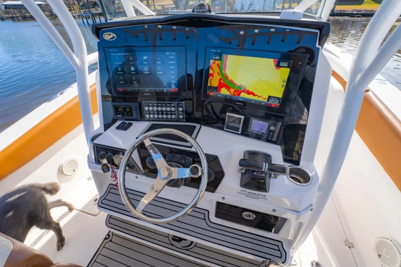 Slide: The Image of 2019 Sea Fox 328 Commander helm with advanced navigation displays and controls. - 16